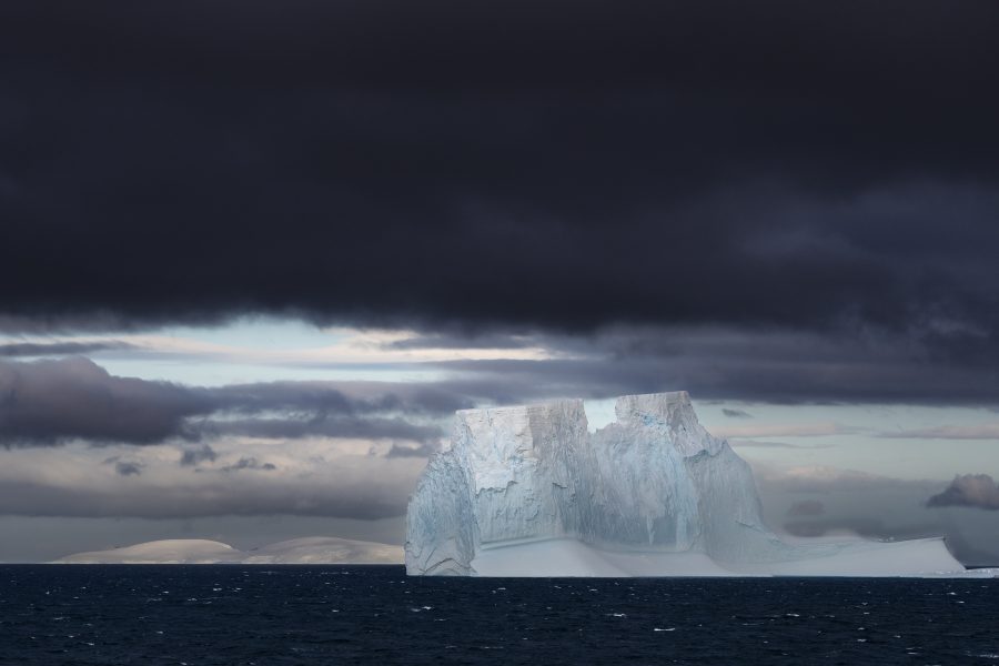 Antarctic Iceberg Dwarfs the Landscape - An Miranda
